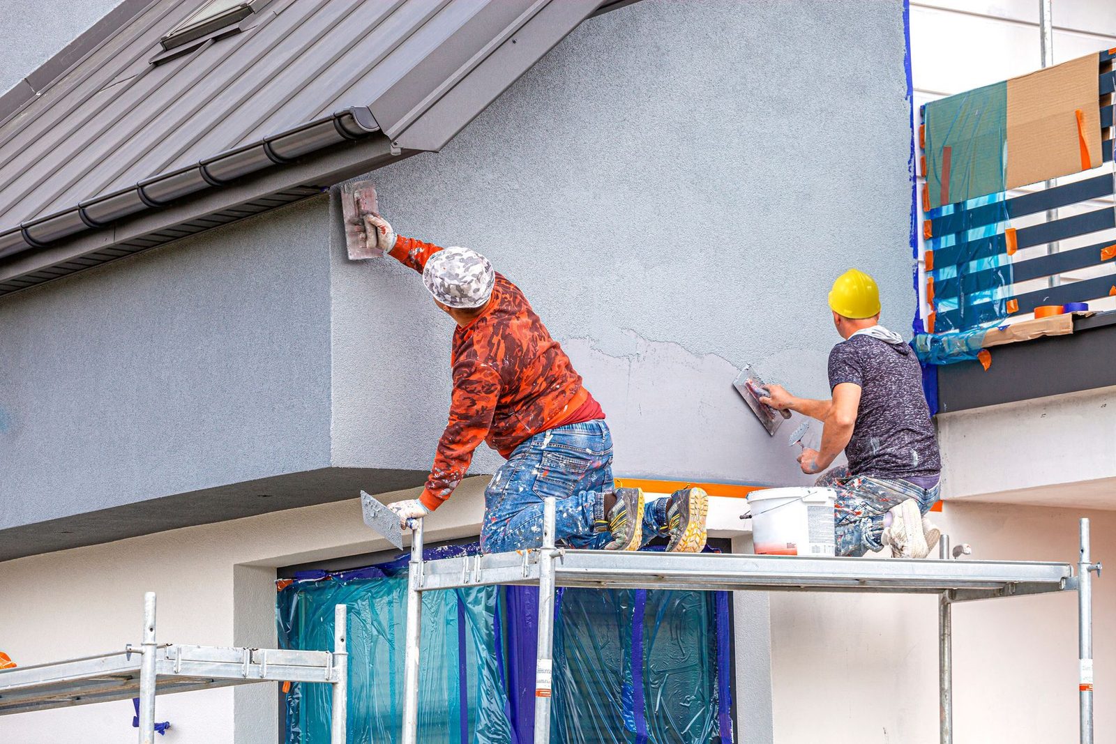 Professional painters working on a home exterior